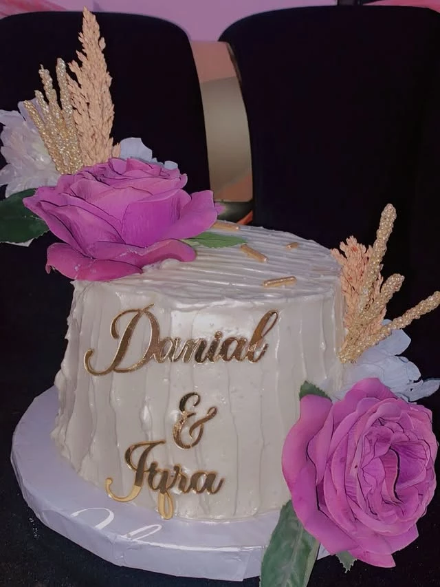 Stunning vanilla wedding cake decorated with fresh roses for Danial and Iqra's ceremony - Premium Wedding Cakes Karachi By Whisk And Sift